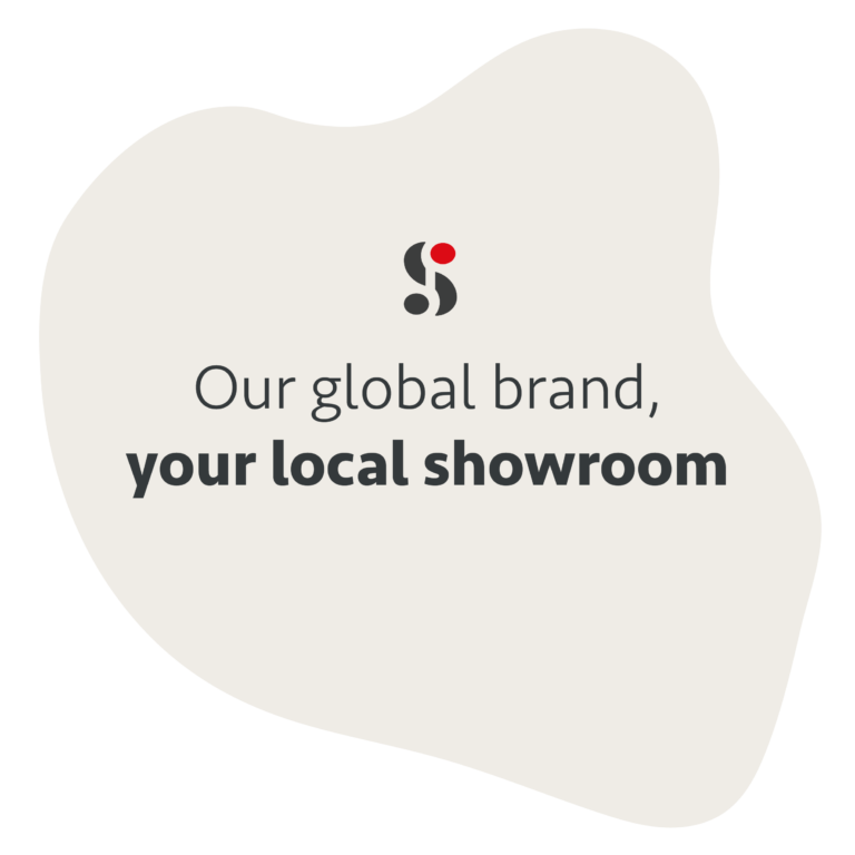 Promotional graphic stating 'Our global brand, your local showroom' Minimalist beige graphic featuring the Schmidt Kitchens logo and a message about their international reach and local support. Clean, modern branding suited to franchise promotion.