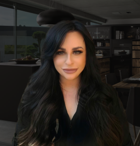 A confident woman with styled black hair is positioned in front of a high-end kitchen showroom. The portrait adds a modern and polished feel to the setting.